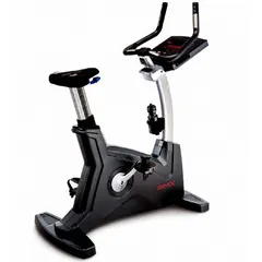 This upright exercise bike features a self-powered drive system that requires no external electricity, making it suitable for indoor cardiovascular fitness training in commercial or institutional settings. The gray unit has an overall length of 78 inches and offers 20 resistance settings to accommodate varied workout intensities.