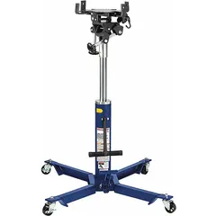 This mechanical transmission jack has a 0.5 ton load capacity and a steel frame. It is operated by a foot pedal for lifting and positioning transmissions during vehicle service and repair tasks in automotive workshops and industrial maintenance settings.