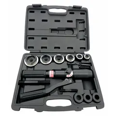 This knockout punch tool kit creates holes in steel panels and enclosures. The set includes six hydraulic punch dies, three adaptors, two power screws, a drill bit, and a carrying case. Punch range is 1/2 in to 2 in. Typical applications include electrical, HVAC, and industrial maintenance for conduit, cable, or pipe entry points.