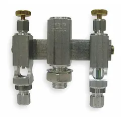 Replacement valve for oilers with two feeds, featuring 1/4" NPTF inlet and outlet threads and a straight spray pattern flow. Used for precise flow control in lubrication systems on industrial machinery.