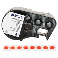 Thermal transfer precut label roll cartridge with integrated ribbon for single-pass printing. Labels are 3/8 in circles, black on red, made of cryogenic autoclavable nylon, designed for identifying 1.5 mL vials and tubes. Compatible with BMP41 printer series. Suitable for laboratory and cryogenic storage applications requiring labels that withstand extreme cold and autoclaving.