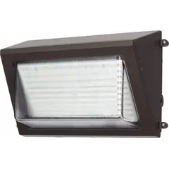 LED full-size wall pack delivering 10,000 lumens at 80 watts with selectable color temperatures of 3000K, 4000K, or 5000K. Features Type IV distribution and operates on 120 to 277V AC input. Bronze finish, overall height 7 1/2 inches. Suitable for building perimeters, parking lots, and walkways.