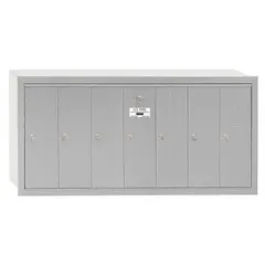 Vertical multi-unit mailbox with 7 lockable front-access doors. Measures 19 in H x 40 3/4 in W x 7 1/2 in D for recessed mounting. Suitable for apartment buildings, condominiums, or commercial facilities requiring secure mail distribution.