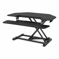 This manual adjustable-height desk converter transforms a fixed desk into a sit-stand workstation. It features a black steel frame and a black medium-density fiberboard desktop, with a removable keypad tray. Overall width is 36 inches.
