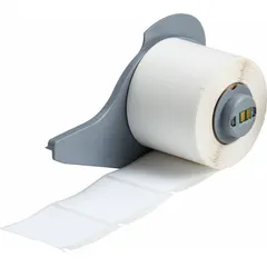 Thermal transfer precut label roll measuring 1 1/2 in x 1 1/2 in. Features a rubber, aggressive adhesive for permanent bonding. Compatible with M710 printer series. Used for asset identification, safety signs, and cable labeling in industrial environments.