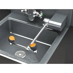 This wall-mount eyewash station provides emergency eye irrigation with eyes-only coverage. It features a chrome-plated brass pipe assembly, swing-down operation, and left-of-center supply. Suitable for use in laboratories, factories, and chemical processing areas where plumbed eyewash is required.