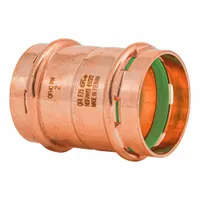 This 2 in CTS press coupling is used to join copper tubing in plumbing systems. The dimple center stop ensures correct insertion depth, and the visible seal window confirms a proper press connection. Made of copper or bronze