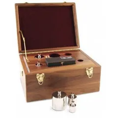 This metric calibration weight kit includes a 1 kg stainless steel cylinder weight and a tweezer for handling. It is used to verify and adjust the accuracy of industrial scales and balances in applications requiring precise mass reference.