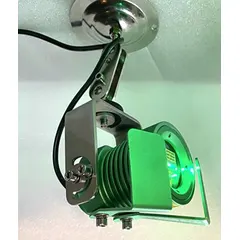 Green laser line projector with lens for alignment and positioning tasks. Operates at 110 V AC and includes a mounting bracket. Suitable for industrial layout, machining, and assembly applications.