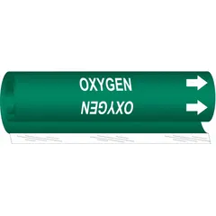 This wrap-around pipe marker identifies oxygen lines with a green background and white legend. It fits pipe outer diameters from 2-1/2 to 7-7/8 inches and includes directional arrows. Suitable for use in industrial facilities to mark piping systems.